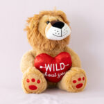Loved Up Lion, On purple background , Poppy Rose Flowers, Same Day Delivery